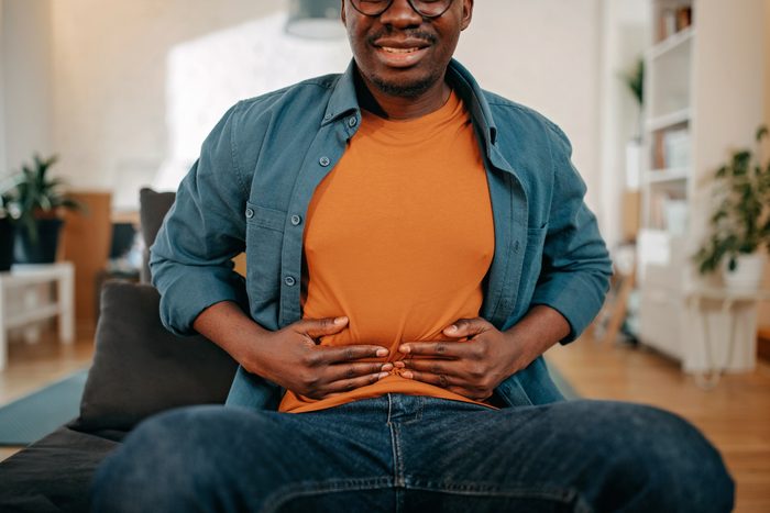 Young black man experiencing pelvic pain