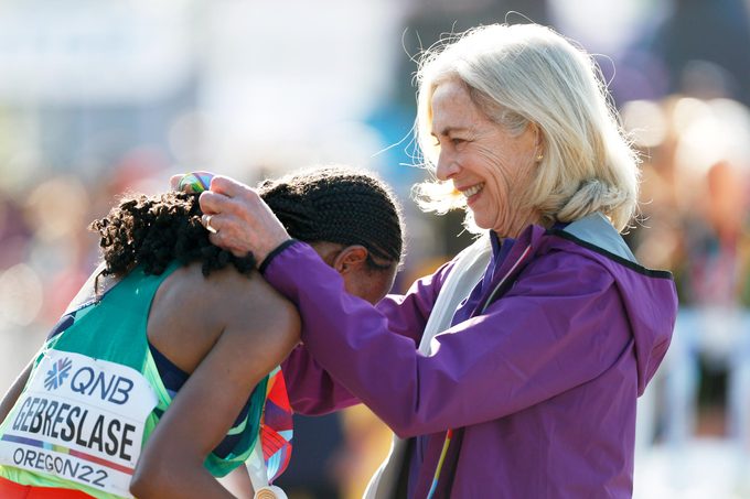Gold medalist Gotytom Gebreslase of Team Ethiopia receives her medal from Kathrine Switzer after competing in the Women's Marathon on day four of the World Athletics Championships Oregon22