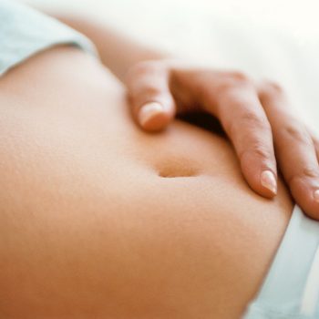 woman's hand on her stomach